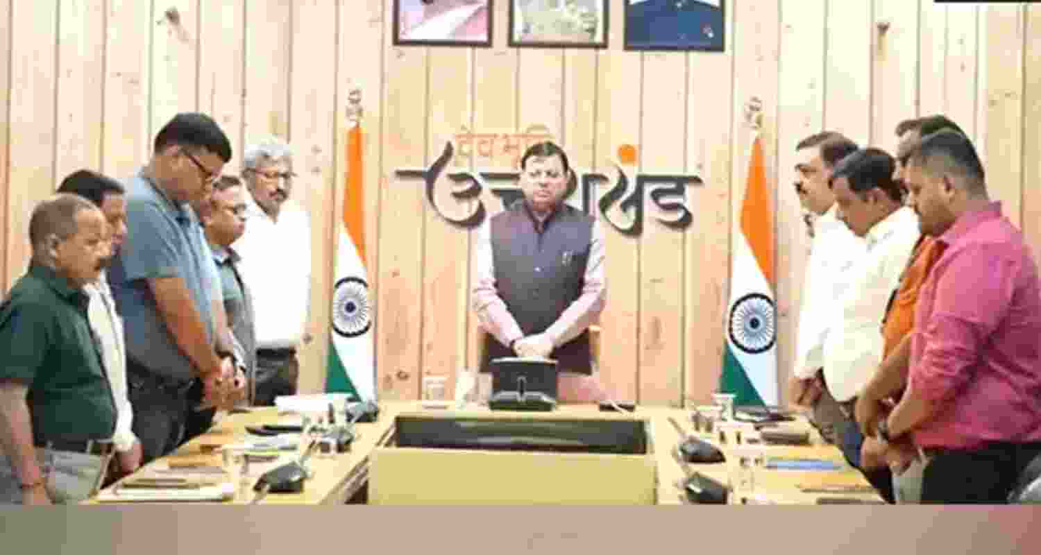 Uttarakhand CM Pushkar Singh Dhami observes two minutes silence for victims of AI-171 plane crash.