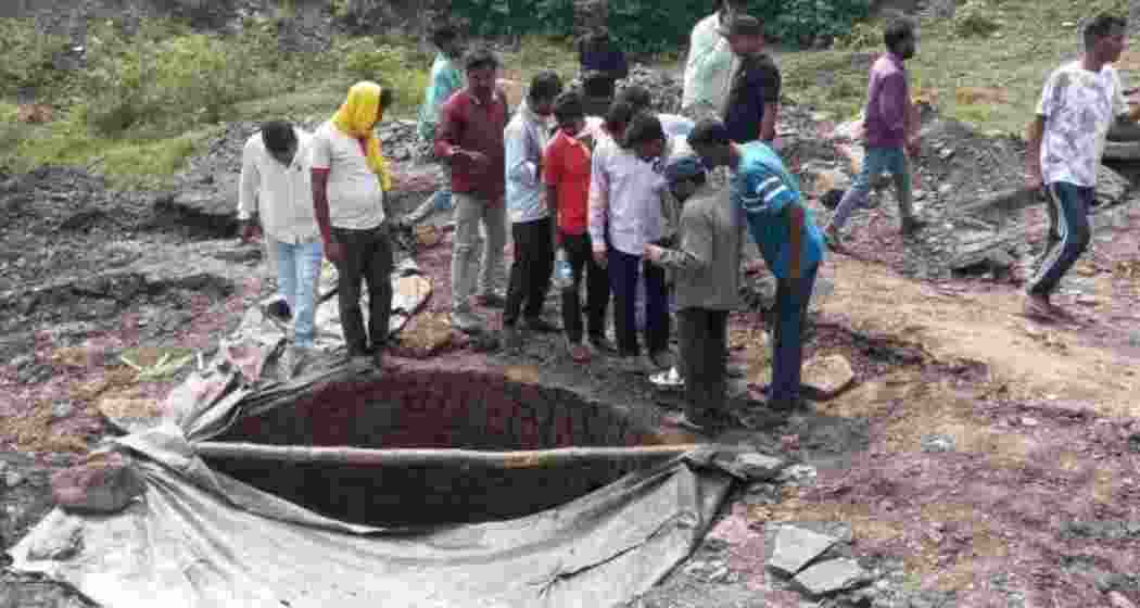 Locals gather at the spot after a portion of a coal mine collapsed on Wednesday in Jharkhand's Dhanbad district.
