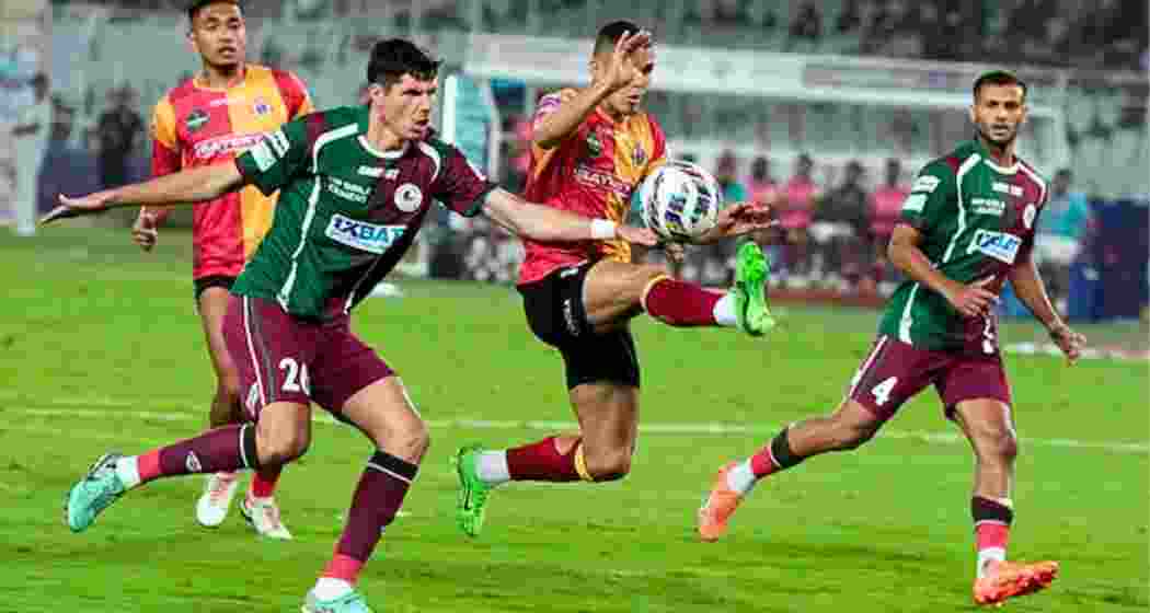 East Bengal and Mohun Bagan Super Giant players in action.