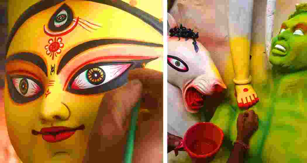 Kumartuli artisans give finishing touches of colour to Durga idols.