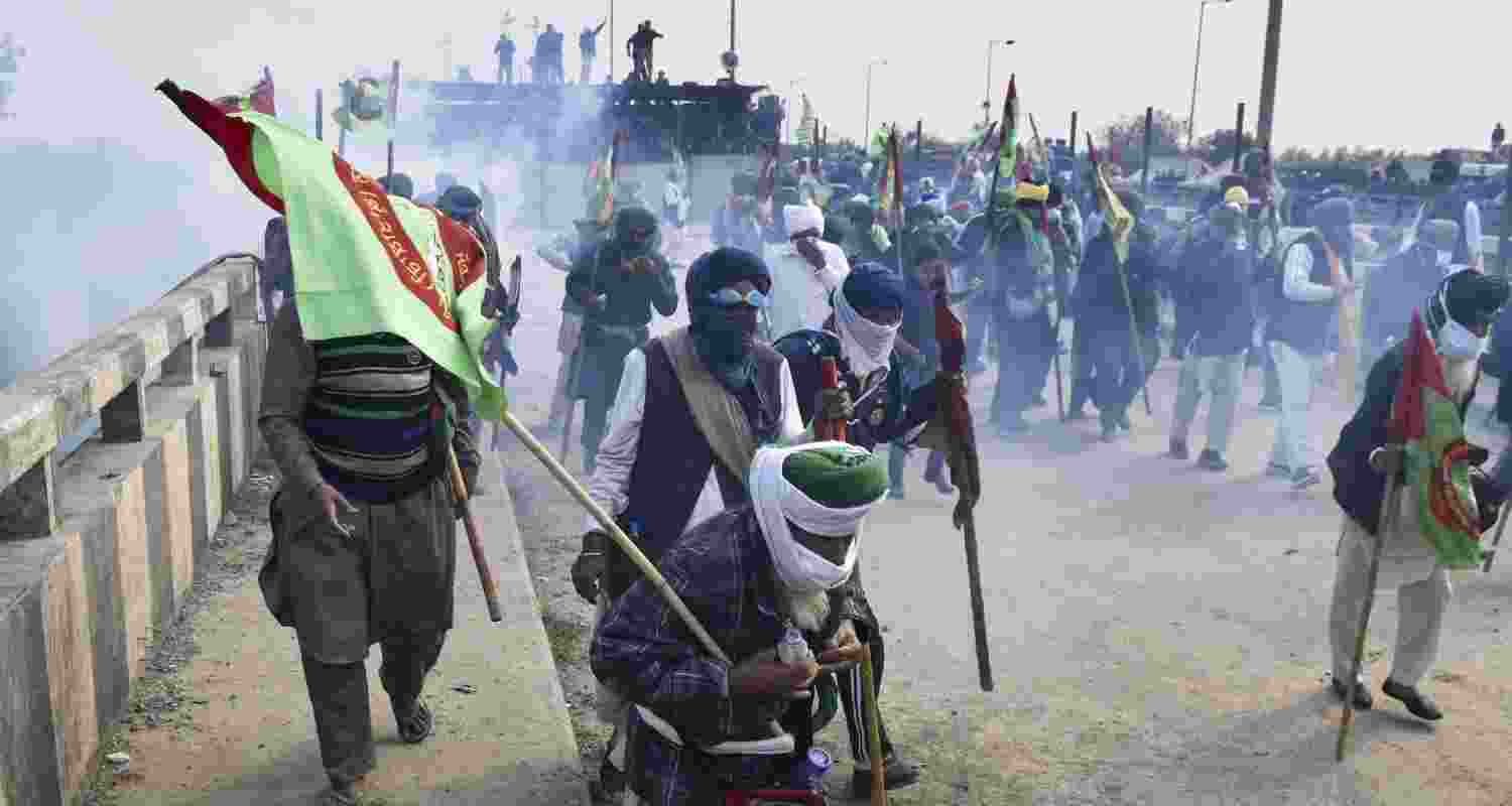 Tear gas being used to disperse protesting farmers at Shambhu Border during their foot march towards Delhi, in Patiala district, Sunday.