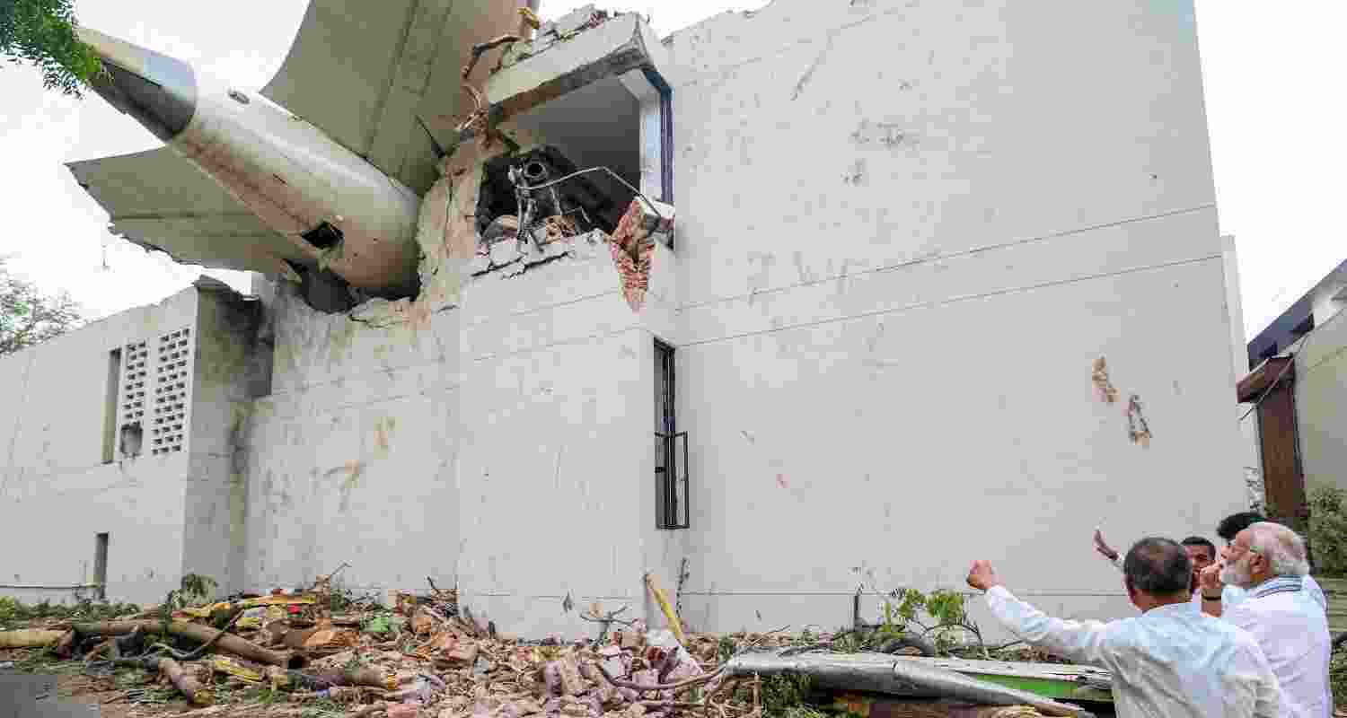 Prime Minister Narendra Modi visits the site of the Air India plane crash, in Ahmedabad, Friday.