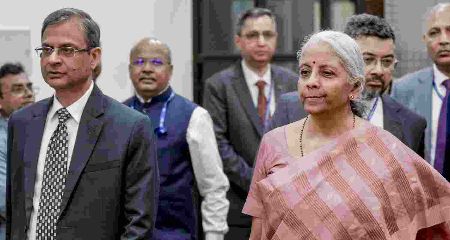 Finance Minister Nirmala Sitharaman, right, and RBI Governor Sanjay Malhotra arrive for a Central Board meeting of the Reserve Bank of India, at the RBI headquarters, in New Delhi, Monday. 