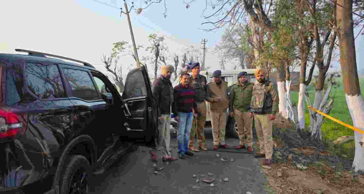The police and CIA staff at the encounter site in Doraha.