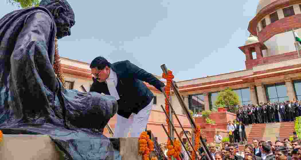 Newly sworn-in Chief Justice of India Bhushan Ramkrishna Gavai pays tribute to BR Ambedkar at the Supreme Court premises, in New Delhi, Wednesday.