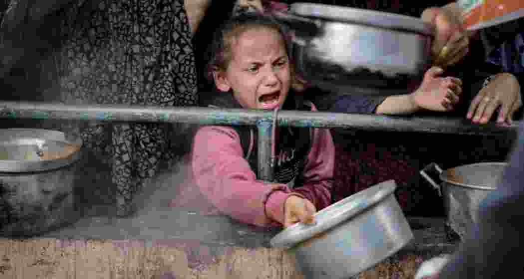 A child cries out for food at a Gaza distribution centre.