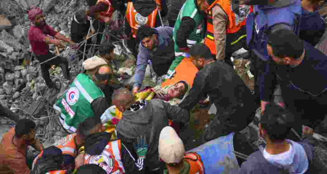 Alaa Manoun, who is seven months pregnant, is rescued from her family’s home after it was struck by an Israeli army attack that killed at least seven people, including her mother, daughter and husband, in Jabalia al-Balad, Gaza City, April 13, 2025.