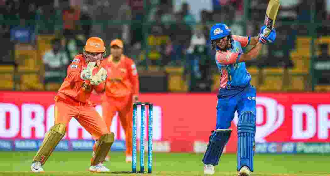 Mumbai Indians batter Harmanpreet Kaur plays a shot during a Women's Premier League match between Mumbai Indians and Gujarat Giants.