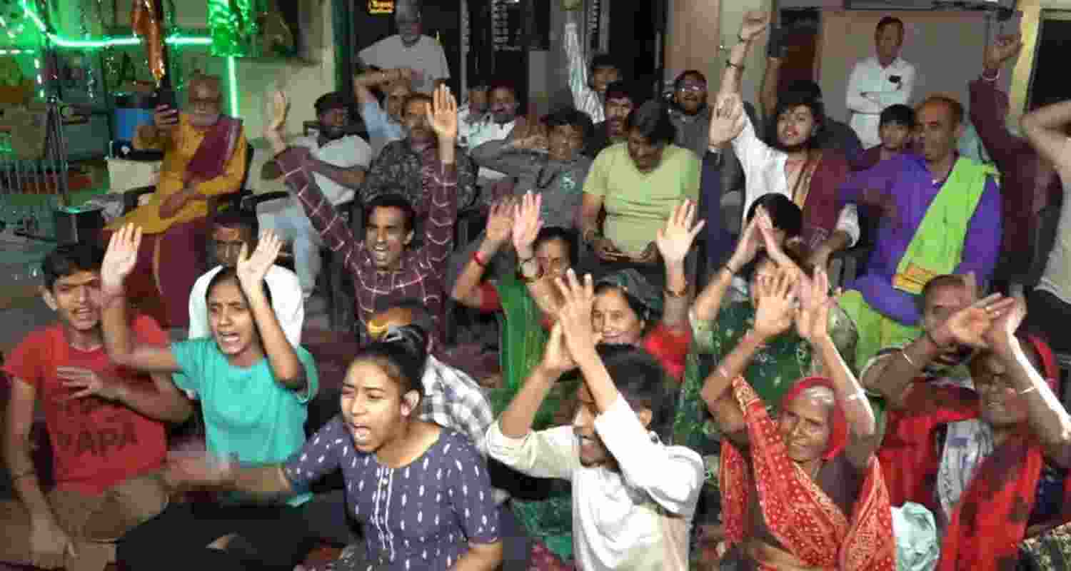 Residents of NASA astronaut Sunita Williams' ancestral village Jhulasan celebrate upon her safe return to earth from the International Space Station (ISS), in Mehsana district, Gujarat, early Wednesday morning.