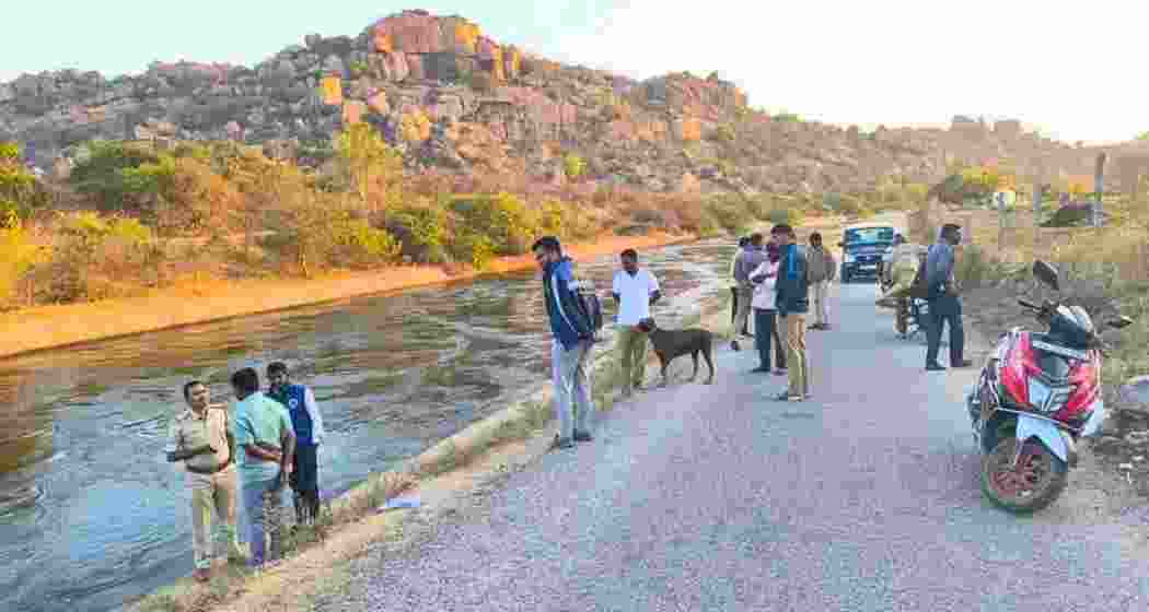 Police officers inspect the site near Hampi where an Israeli tourist and a homestay host were gang-raped. Authorities have arrested two suspects, while a search is underway for the third accused.