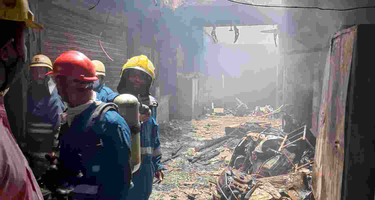 Firefighters carry out rescue work after a fire broke out in a building near Gulzar Houz in the Old City area of Hyderabad in Telangana, Sunday
