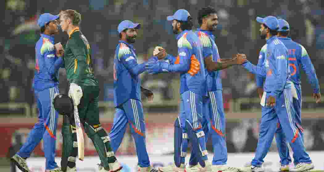 Indian players being congratulated by South African Corbin Bosch after winning the first ODI cricket match of a series between India and South Africa, at JSCA International Stadium Complex, in Ranchi, Jharkhand on Sunday.