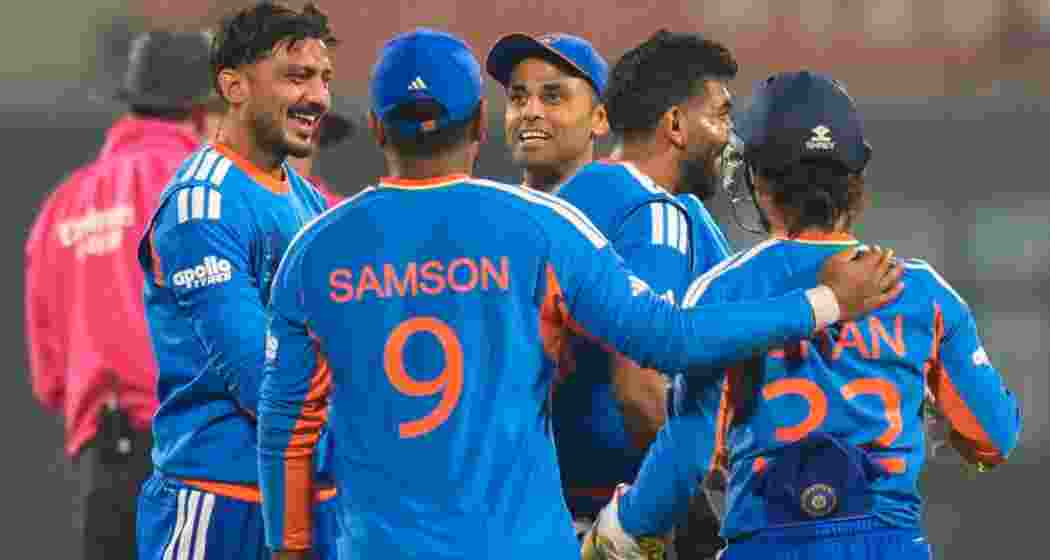 India's Axar Patel, left, celebrates with teammates after taking the wicket of Namibia's Malan Kruger during an ICC Men's T20 World Cup 2026 cricket match between India and Namibia, at the Arun Jaitley Stadium, in New Delhi on Thursday.
