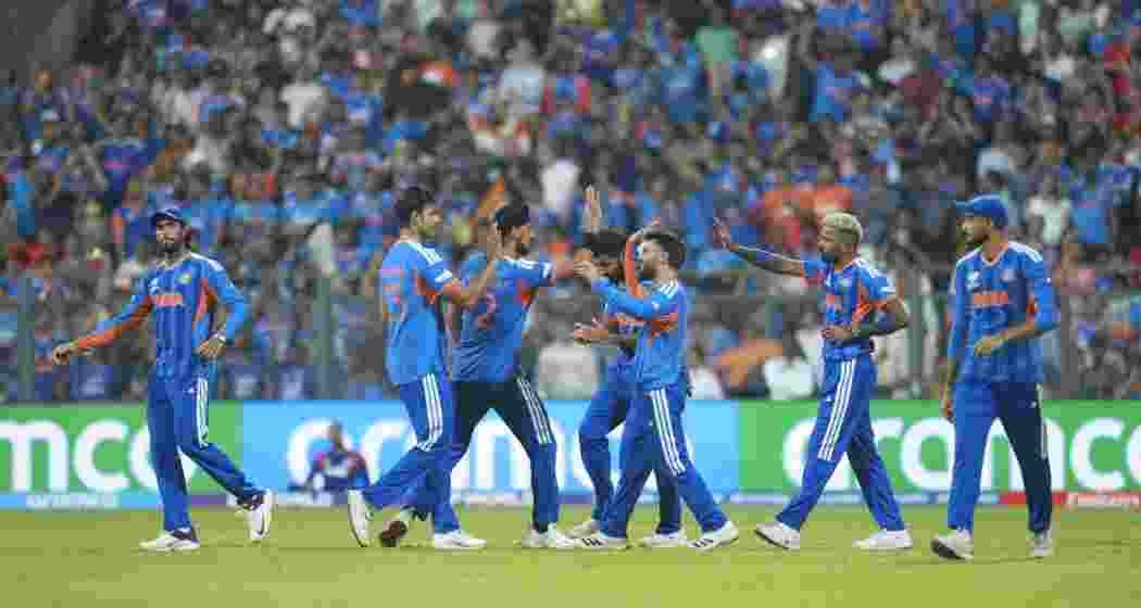  India's players celebrate the wicket of England's Jacob Bethell during the ICC Men's T20 World Cup 2026 second semifinal cricket match between India and England, at the Wankhede Stadium, in Mumbai, Maharashtra on Thursday.