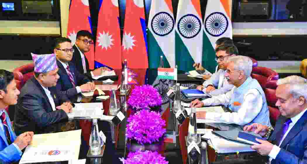 Indian and Nepalese foreign ministers and officials during a bilateral meeting.