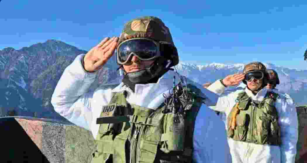 Indian Army personnel salute the national flag at the Uri sector in Jammu and Kashmir’s Baramulla district on the 76th Republic Day.