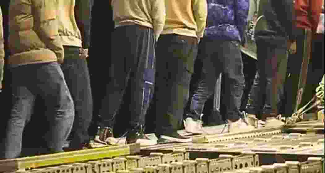 As the US military C-17 aircraft prepares for take-off footage shows handcuffed, shackled Indian deportees boarding the plane. 