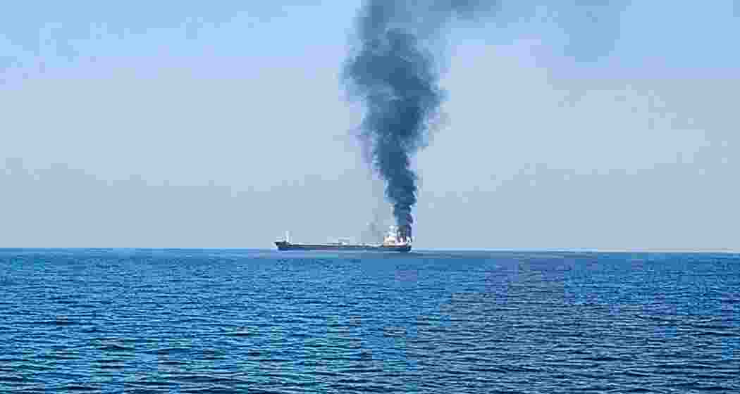 Smoke rises from the vessel Settebello after a US strike off the coast of Oman, in which three Indian seafarers were killed, escalating tensions in the Gulf region.