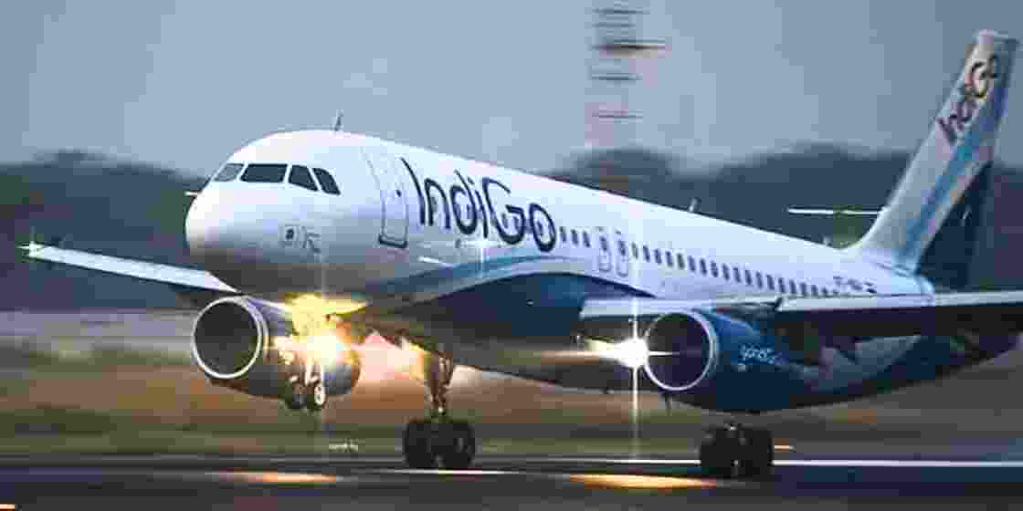 An IndiGo aircraft takes off from the runway. 