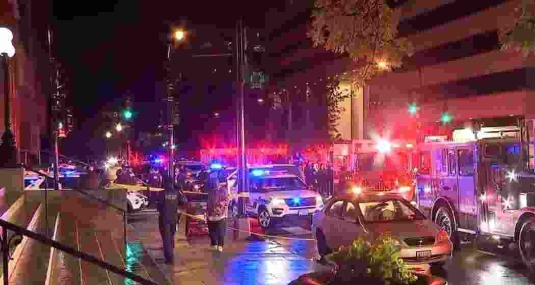 Police personnel inspect the area near Washington’s Capital Jewish Museum, where two Israeli Embassy staffers were shot dead late Wednesday night.