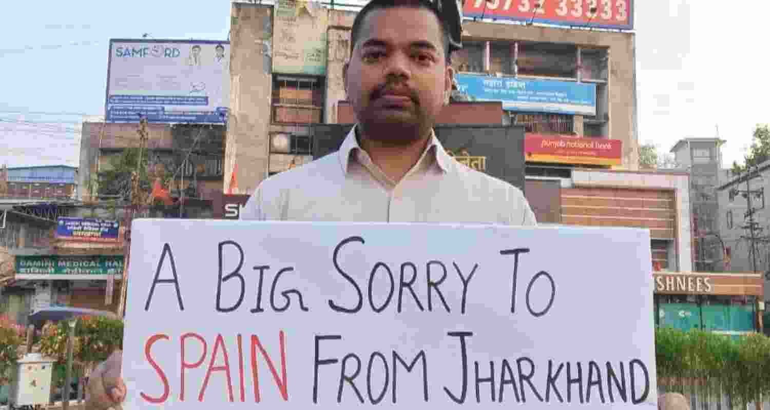 A youth holding a poster stands in solidarity with the victim of Dumka gangrape case at Ranchi's Albert Ekka Square on Monday.  