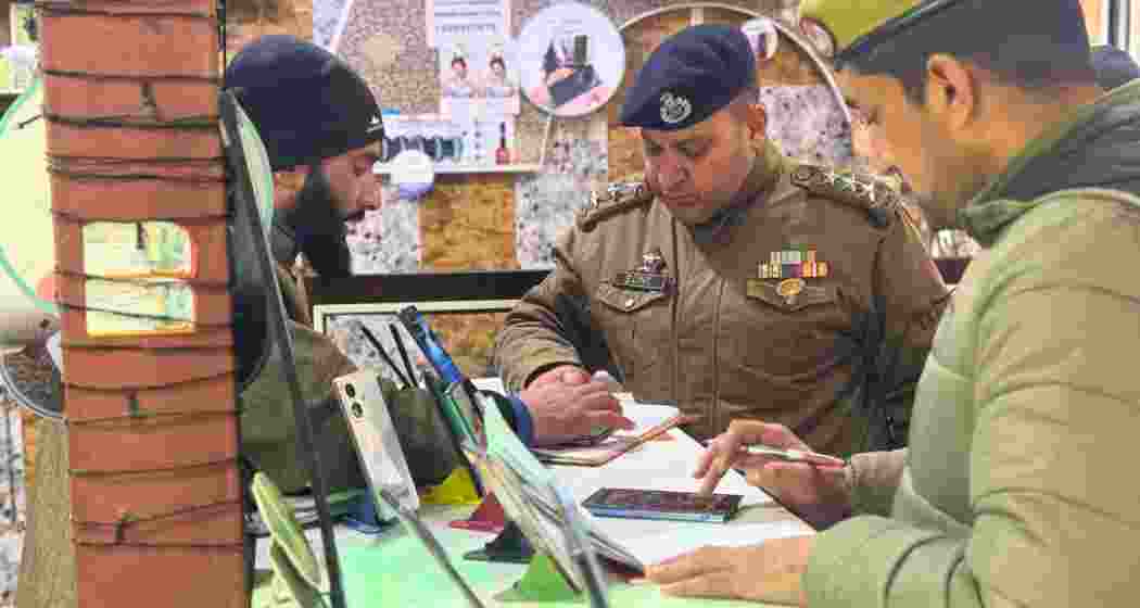 Jammu and Kashmir police personnel conducting a verification drive to regulate SIM card vendors and curb fraud and misuse of mobile connections. File photo.