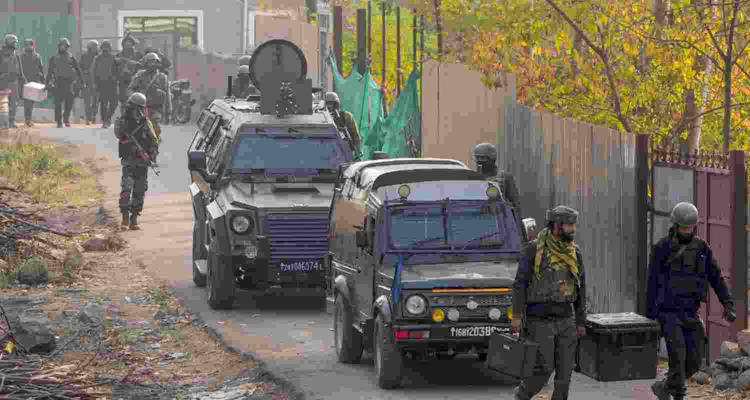 Security personnel during an encounter with terrorists at Zabarwan forest area on the outskirts of Srinagar. 