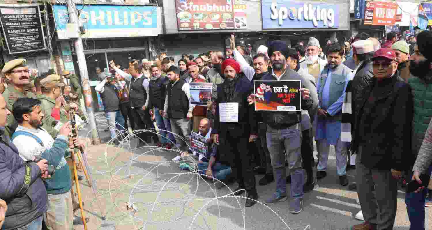 J&K police stop Congress workers from marching to Raj Bhavan. 