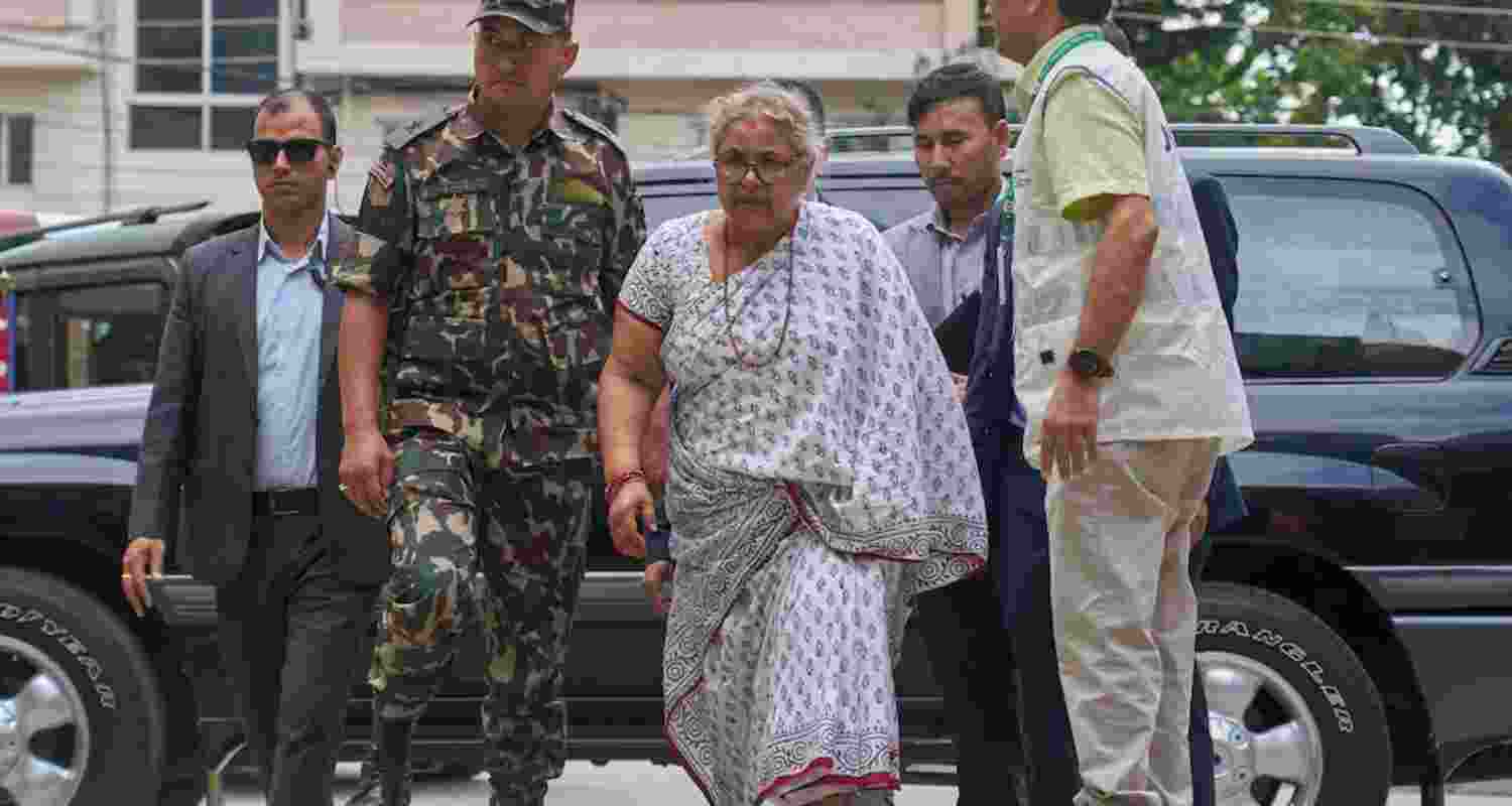 Nepalese residents step out as curfew is lifted in Kathmandu after the appointment of the country’s first woman prime minister, following a week of deadly protests.