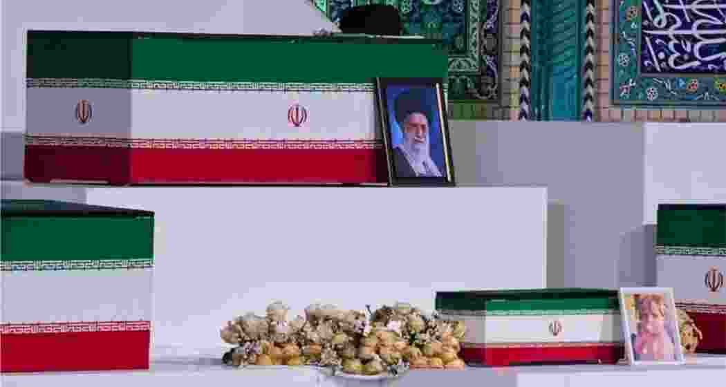 Coffins of Iran's late Supreme Leader Ali Khamenei and his family members are placed on display during a public tribute ahead of the funeral ceremony.