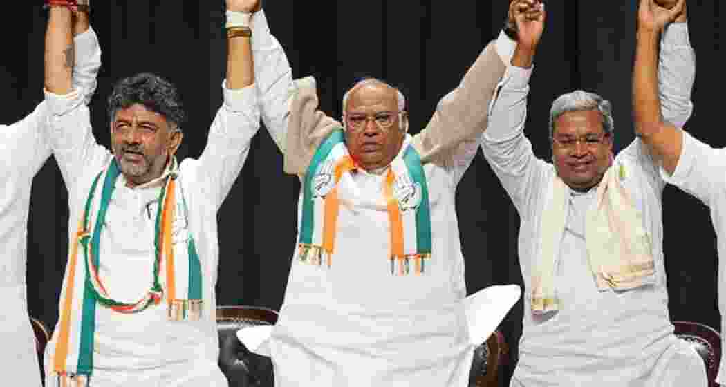 Karnataka Deputy Chief Minister D.K. Shivakumar, Congress president Mallikarjun Kharge, and Chief Minister Siddaramaiah at a party meeting in Bengaluru.