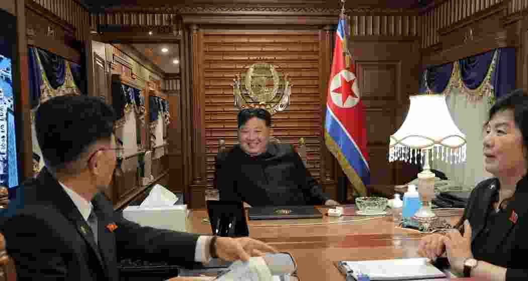 North Korean leader Kim Jong Un, center, leaves Pyongyang, North Korea by train Monday, September 1, heading to Beijing.