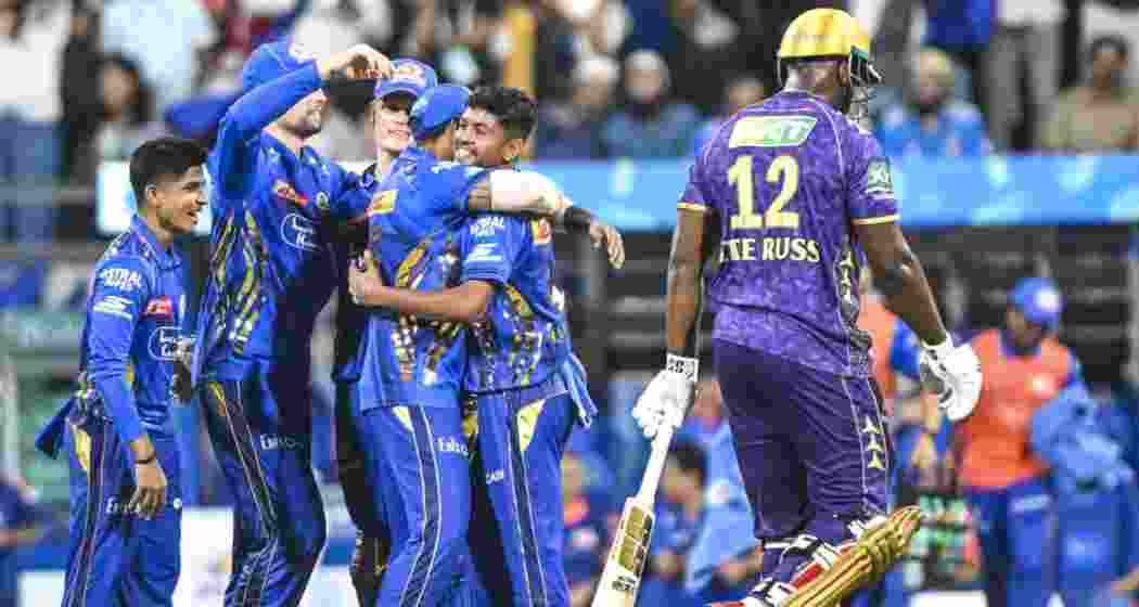 Mumbai Indians' Ashwani Kumar (L) celebrates after taking a wicket