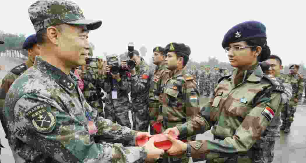Indian and Chinese soldiers exchange sweets during the 2024 Diwali celebrations in Ladakh.