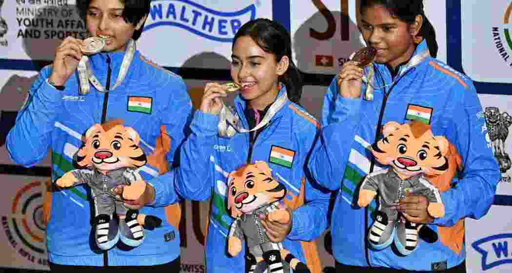 Hrudya Shri, Ojasvi Thakur and Shambhavi Kshirsagar with their medals at the ISSF Junior World Cup in New Delhi on Monday.