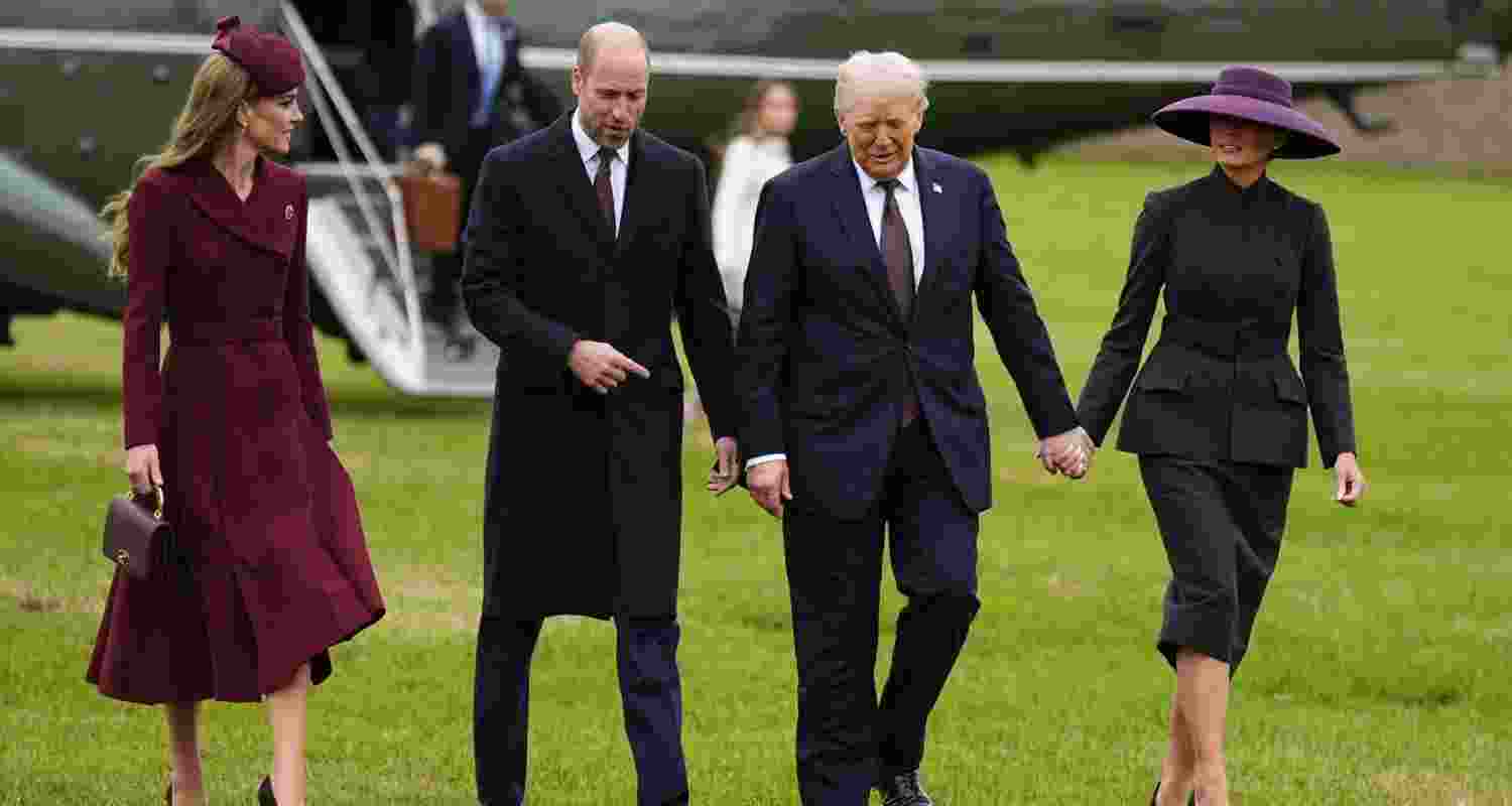 US President Donald Trump and First Lady Melania Trump are greeted by Britain's Prince William, Prince of Wales and Britain's Catherine, Princess of Wales, upon their arrival at the grounds of Windsor Castle, in Windsor, on Wednesday, for the start of a second State Visit.