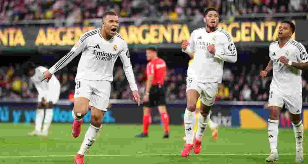 Kylian Mbappé celebrates after scoring his second goal in Real Madrid's 2-1 victory over Villarreal, surpassing Ronaldo's debut season tally and keeping Madrid at the top of La Liga.