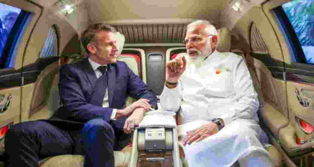 Prime Minister Narendra Modi with French President Emmanuel Macron (L). 