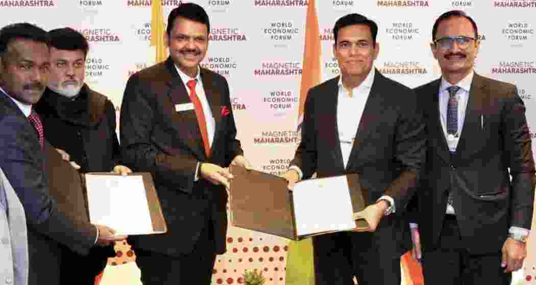 Maharashtra Chief Minister Devendra Fadnavis and JSW Group Chairman Sajjan Jindal during the signing of an MoU for an investment of ₹3 lakh crores in the State, on the sidelines of the World Economic Forum, in Davos, Switzerland. 