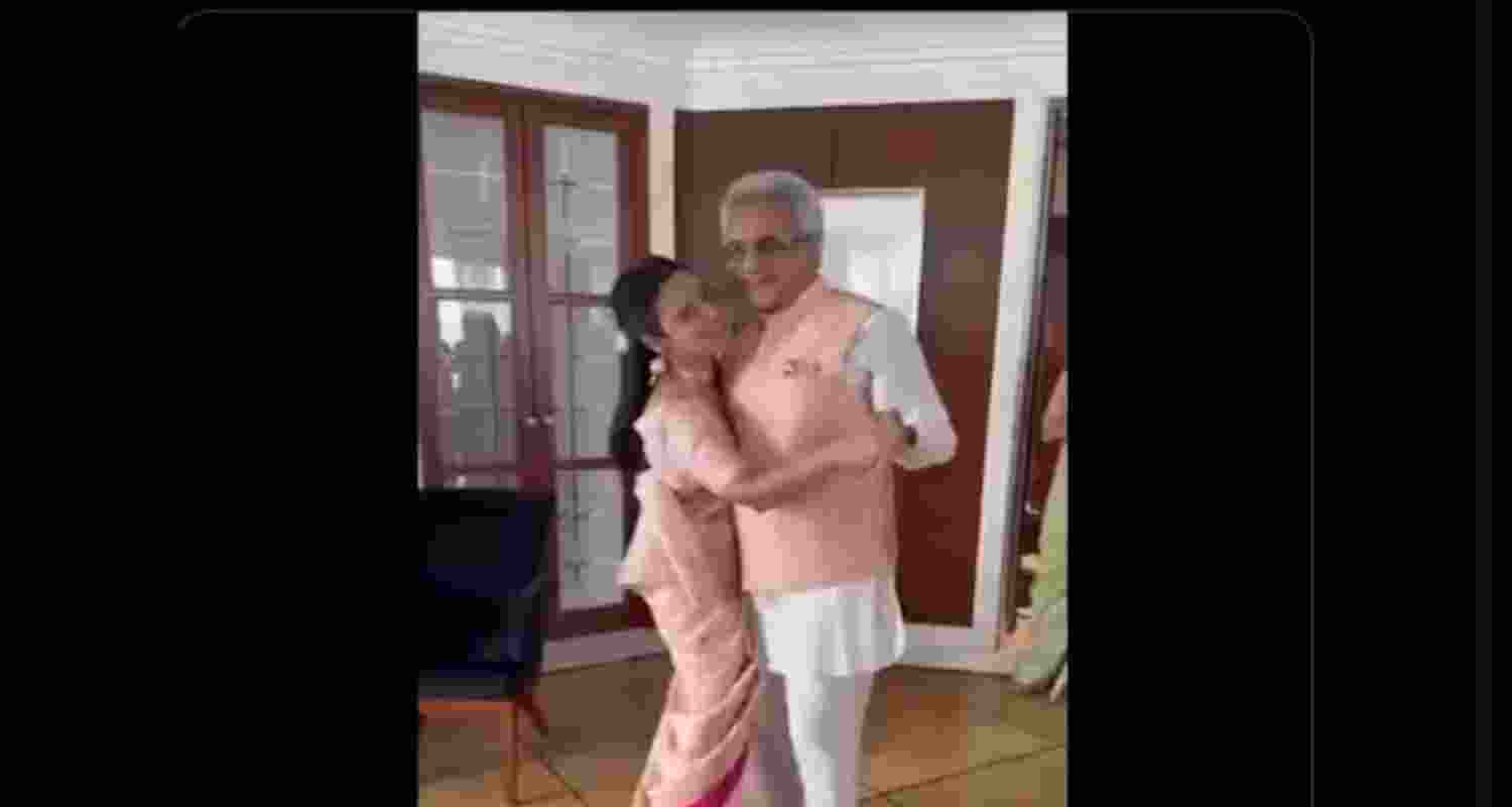 Wearing coordinated peach ensembles, the couple was captured dancing to the music.