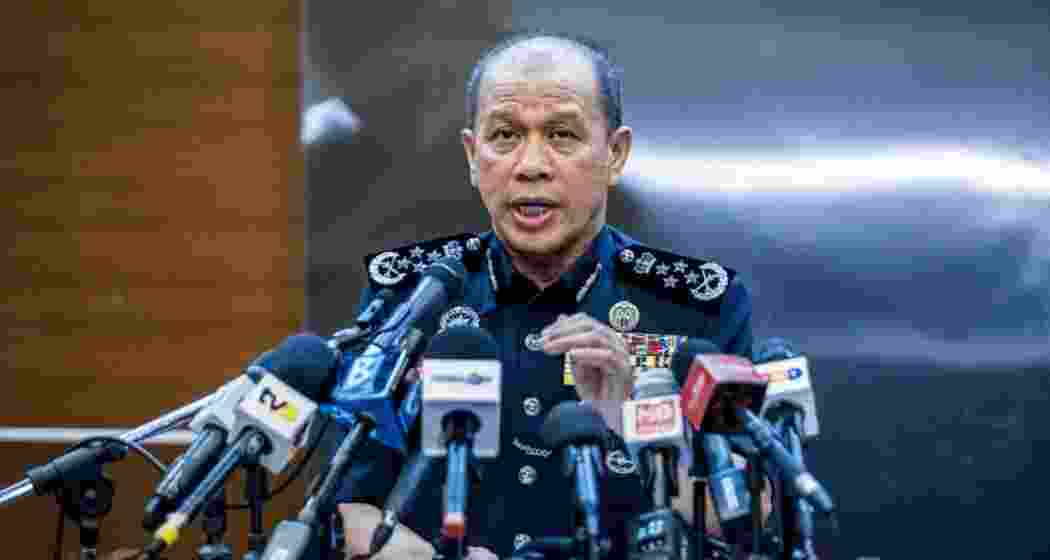 Inspector-General of Police (IGP) Datuk Seri Mohd Khalid Ismail speaks during a press conference at the Bukit Aman police headquarters in Kuala Lumpur on July 4, 2025.