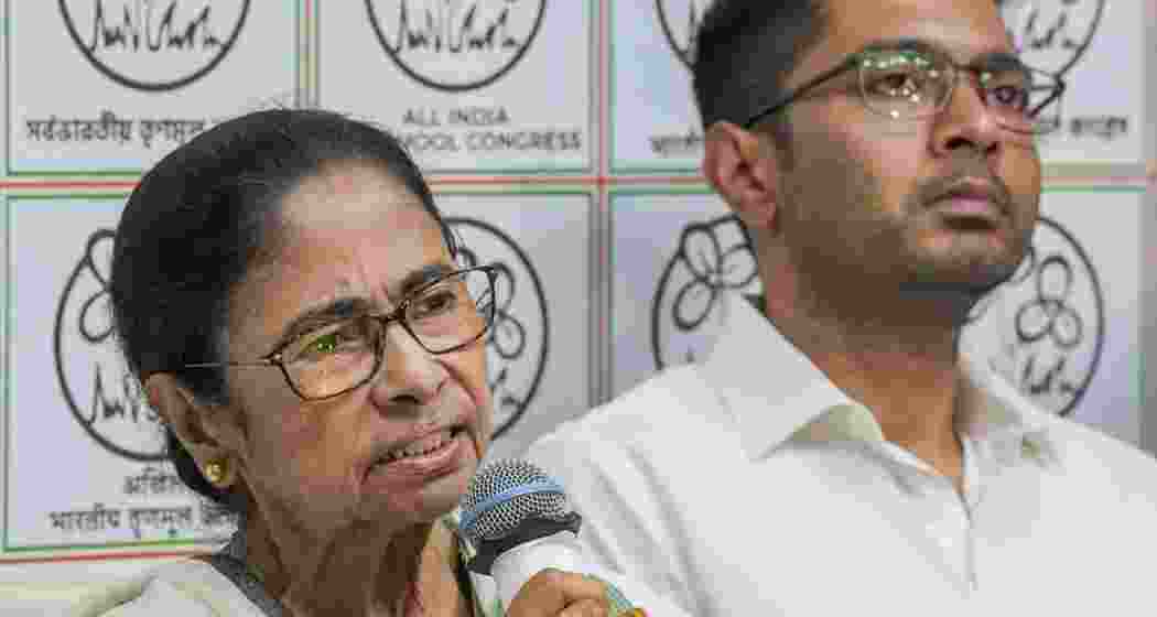 Trinamool leaders Mamata Banerjee and Abhishek Banerjee during a press conference at her Kalighat residence in Kolkata.
