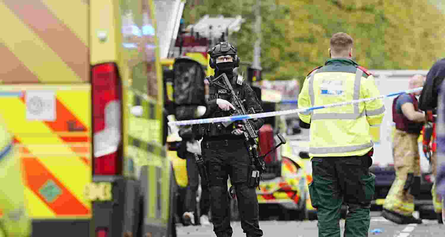 Police stand guard at the scene of the attack.