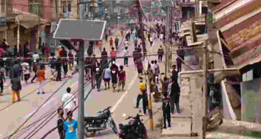  Protestors hurl stones at each other during fresh clashes between Zomi and Hmar tribes in Manipur's Churachandpur on Tuesday.