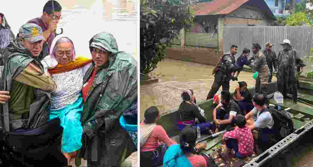Troops and rescue workers evacuate residents from flooded localities in Imphal East on Sunday.