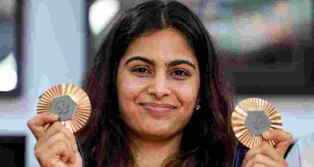 Paris Olympics bronze medallist shooter Manu Bhaker poses with her medals.