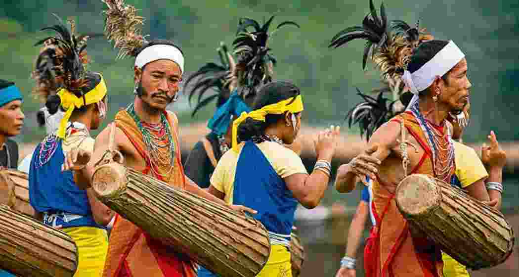 Indigenous tribal communities of Meghalaya perform traditional dances to the rhythmic beats of dhol during a cultural festival.