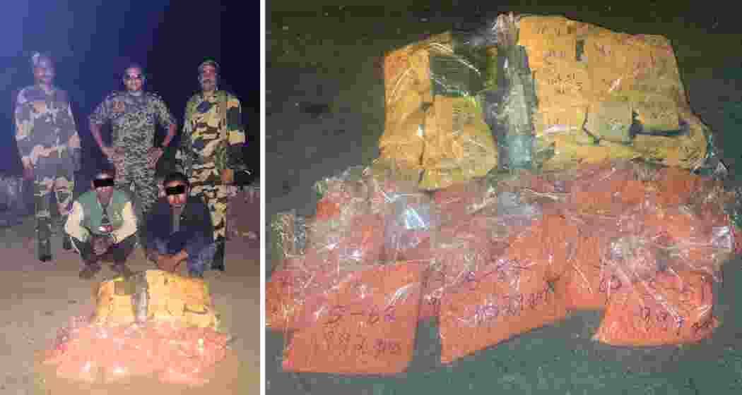 BSF and Mizoram Excise officials display heroin and methamphetamine seized near Aizawl, part of a Rs 26 crore drug bust. Two Myanmar nationals were arrested.