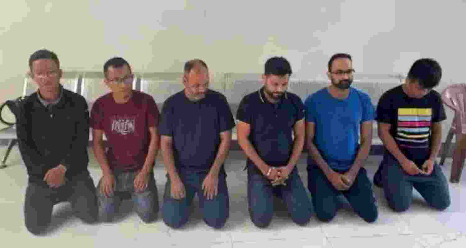 The accused after being held by the police. 