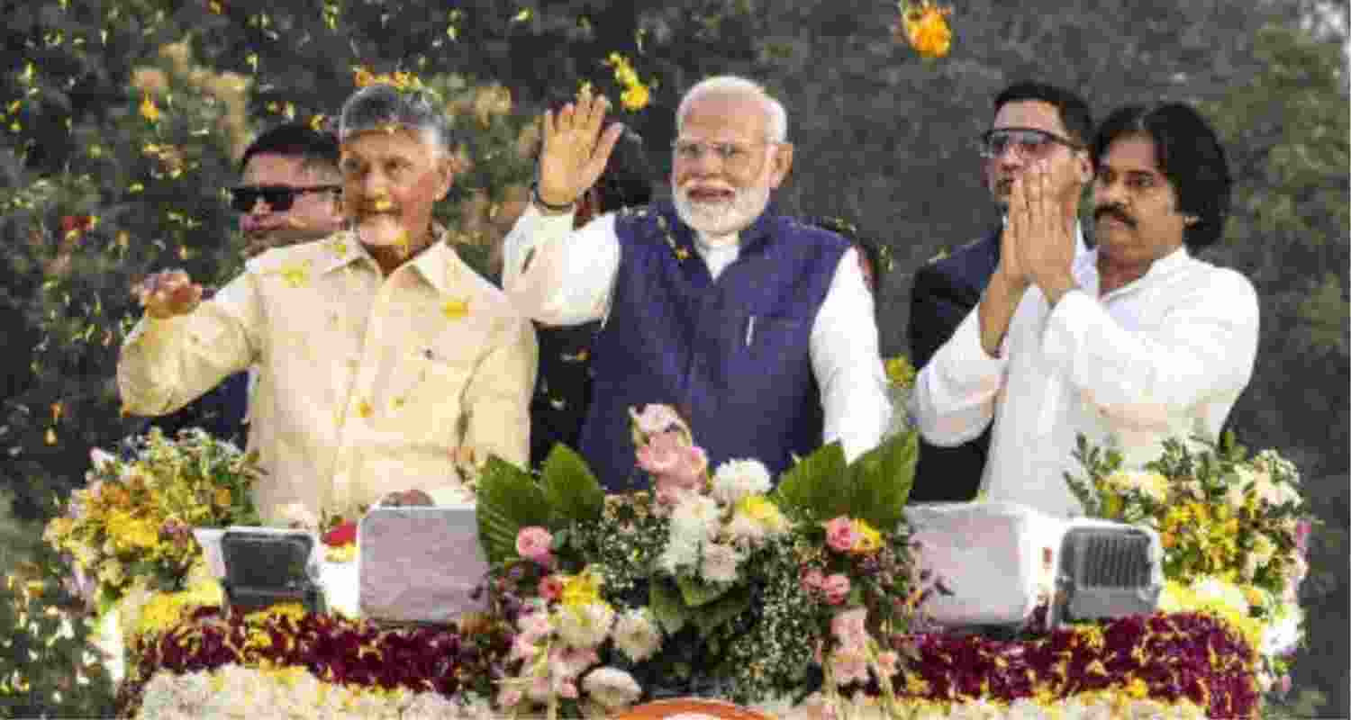 Prime Minister Narendra Modi (centre) with Chief Minister N Chandrababu Naidu (left) and Deputy CM Pawan Kalyan during a roadshow in Andhra Pradesh - file image.  